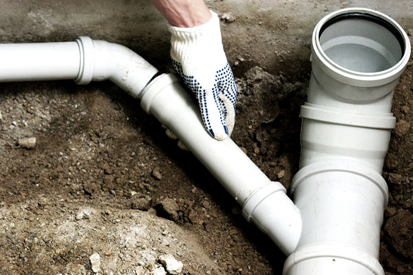 Sewer line repair service white sewer pipe in ground bakersfield plumbers